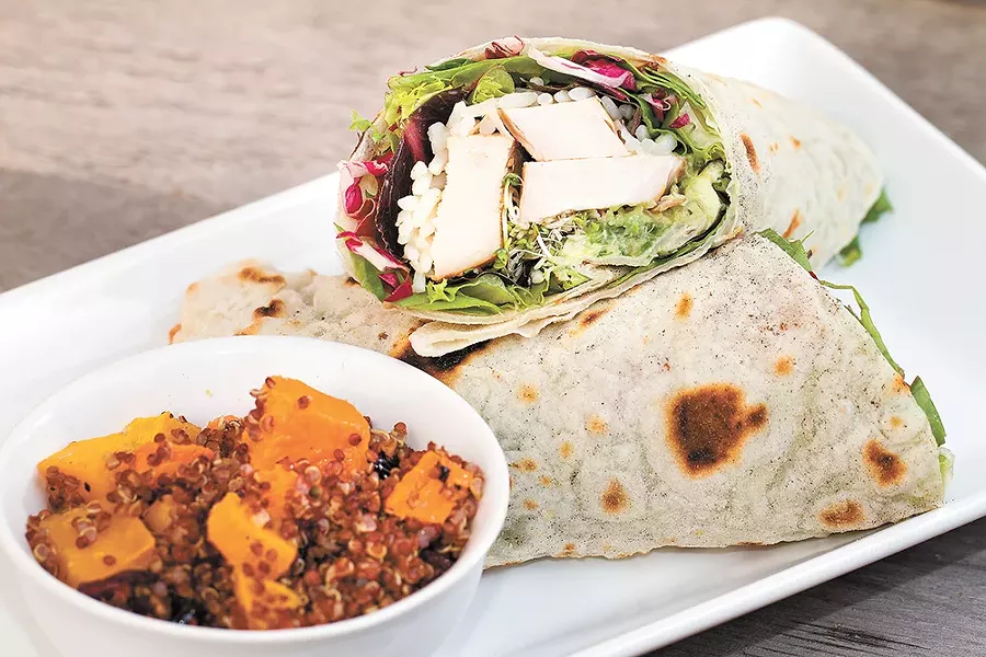 The Yardbird wrap comes packed with grilled chicken, spicy rice, spring greens and housemade guacamole. - BRETT FONTANA