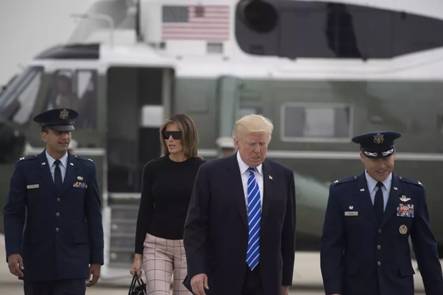 President Donald Trump and first lady Melania Trump prepare to board Air Force One en route to Europe, at Joint Base Andrews in Maryland, July 5, 2017. Trump has plans to meet Russian President Vladimir Putin face-to-face this week on the sidelines of the Group of 20 economic summit gathering in Hamburg, Germany. - STEPHEN CROWLEY/THE NEW YORK TIMES