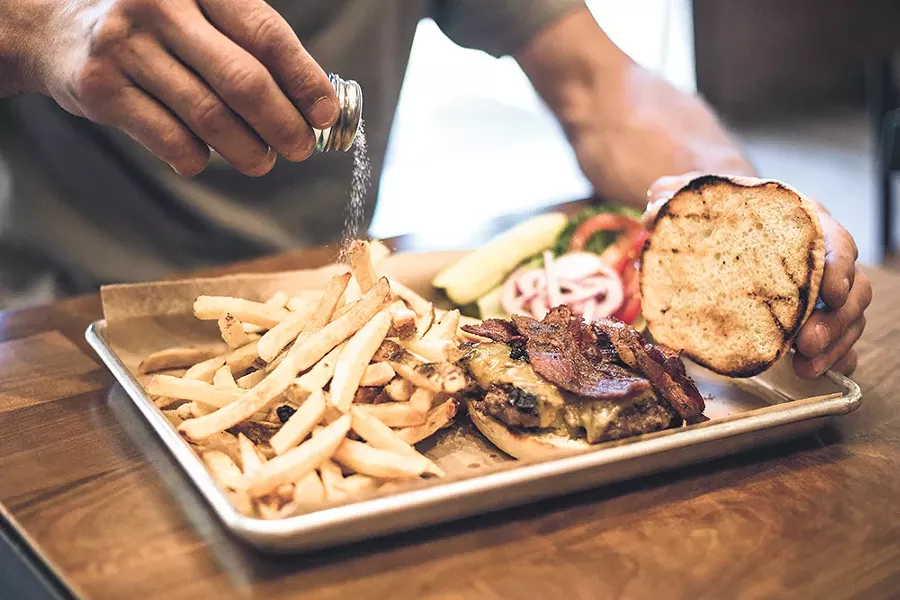 Rustic's burgers are served on its housemade potato buns. - DAN COUILLARD