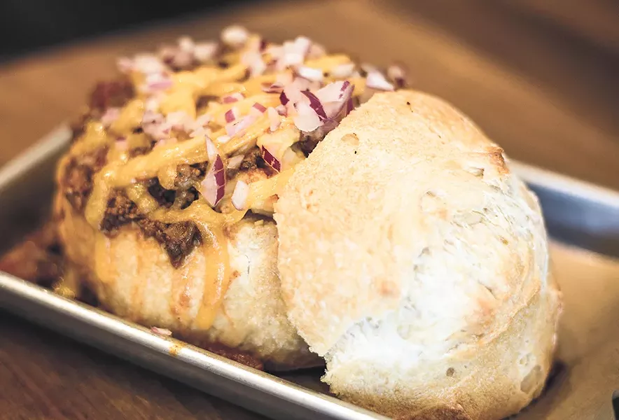This bread bowl stuffed with chili mac is another house specialty. - DAN COUILLARD