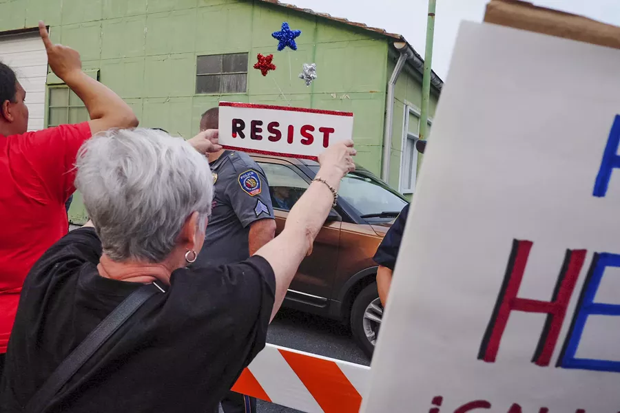 A car carrying Sen. Pat Toomey, who helped draft the Republican health care bill, passes demonstrators in Harrisburg, Pa., July 5, 2017. With Republican health care legislation hanging in the balance, activists feeling betrayed by leaders they helped elect have turned their focus to other issues. - NOAH SCIALOM/THE NEW YORK TIMES