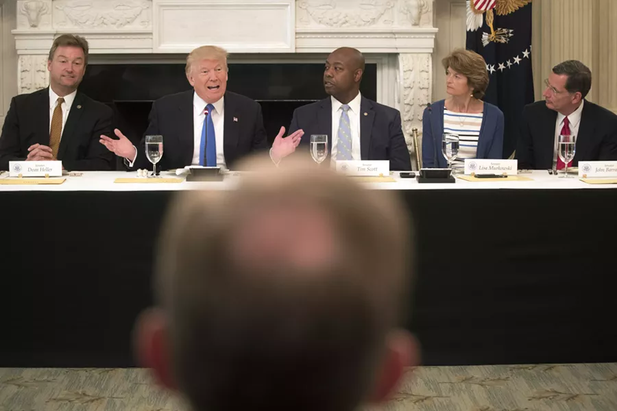 President Donald Trump speaks during a lunch meeting to discuss health care legislation with Republican senators, at the White House in Washington, July 19, 2017. Earlier Wednesday, Trump tweeted that Senate Republicans “MUST keep their promise to America." From left: Sens. Dean Heller (R-Nev.), Tim Scott (R-S.C.), Lisa Murkowski (R-Alaska) and John Barrasso, (R-Wyo) - STEPHEN CROWLEY/THE NEW YORK TIMES