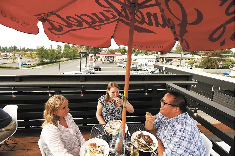 Take a breather between stops at Remedy's rooftop patio. - YOUNG KWAK