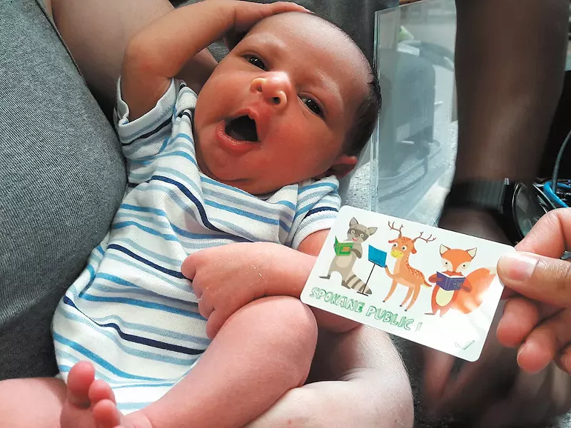 Baby Grant is one of the program's newest library card holders. - RAE-LYNN BARDEN