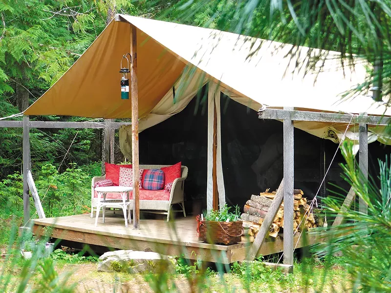 Huckleberry Tent's canvas-walled tents feature porches and a wood-burning stove.