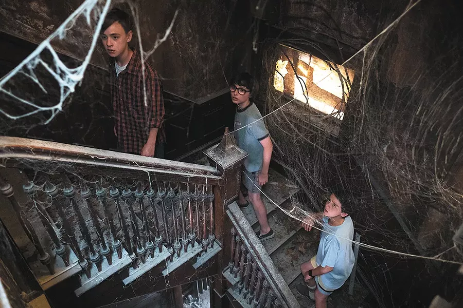 Cobwebs, shadows and creepy clowns: The film version of It is basically a well-oiled carnival funhouse.