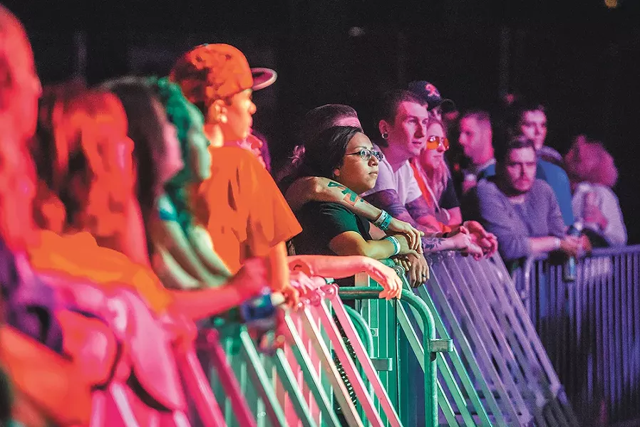 Fans soak in the sounds. - ERICK DOXEY