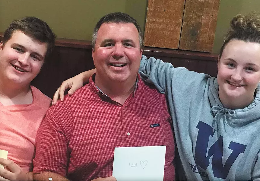 Sam Strahan (left) was killed after he confronted a classmate who brought guns to school. Sam's father, Scott (center), died just 12 weeks before.