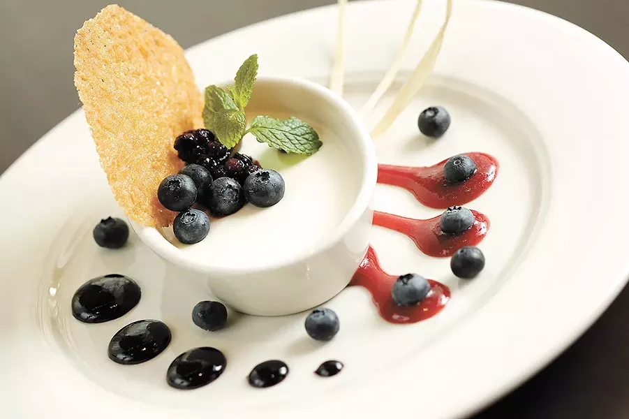 Huckleberry compote adds a tart bite to Wild Sage's Wild Berry Panna Cotta. - YOUNG KWAK