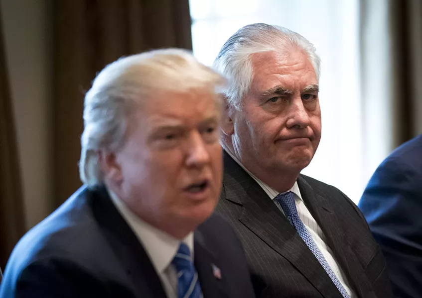 Secretary of State Rex Tillerson sits beside President Donald Trump, who suggested to Forbes that the two should compare IQ tests. - DOUG MILLS/THE NEW YORK TIMES