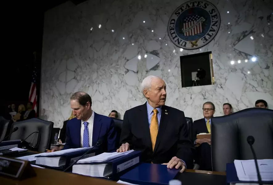 Sen. Orrin Hatch (R-Utah) chairs a Senate Finance Committee executive session on tax policy, on Capitol Hill in Washington, Nov. 15, 2017. Senate Republicans have decided to include the repeal of the Affordable Care Act’s requirement that most people have health insurance into the sprawling tax rewrite. At left is Sen. Ron Wyden (D-Ore.), the ranking Democrat on the committee. - ERIC THAYER/THE NEW YORK TIMES