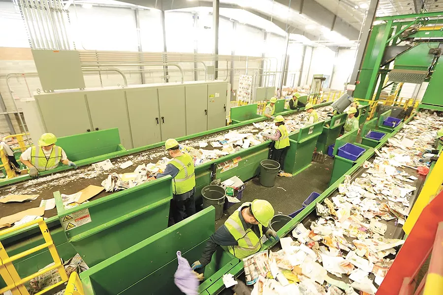 Employees at facilities like Spokane's SMaRT Center hand-pick garbage from the recycling material. - YOUNG KWAK