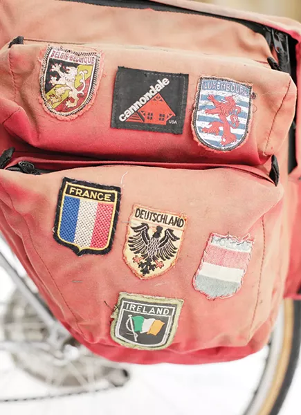 A battered pannier from the trip marks some of her stops. - YOUNG KWAK