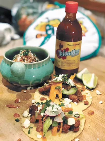 Fried chicken tacos and elote are featured on Cochinito's menu.