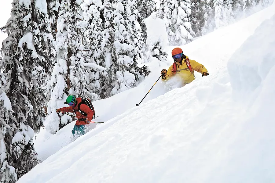 Father and son — Mike and Axel Hattrup — enjoy a rare opportunity to ski together.