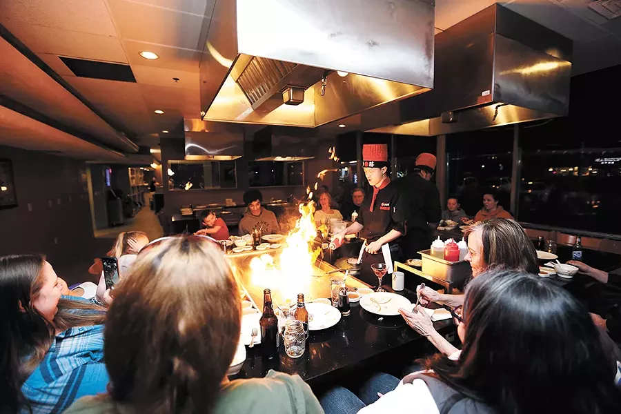 Diners are seated communally at Kobe's three hibachi tables. - YOUNG KWAK