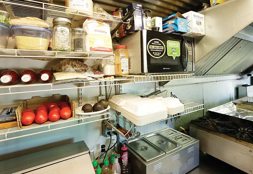 The efficient kitchen inside chef Tony Shields' food truck. - YOUNG KWAK