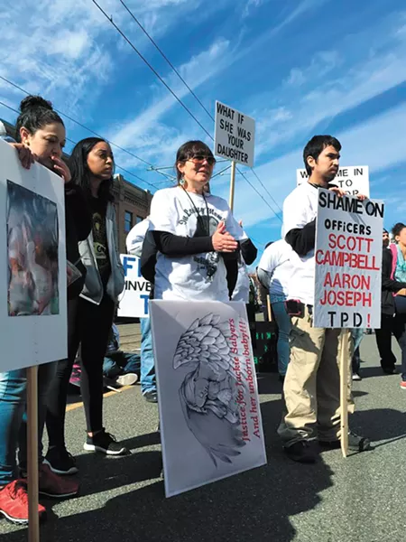 Jacqueline Salyers' mother, Lisa Earl (third from left), turned to activism after her daughter's death by police.