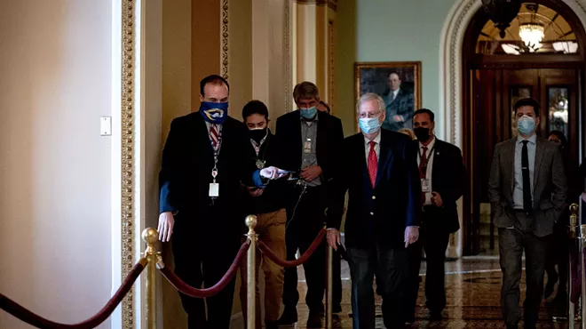Senate Majority Leader Mitch McConnell (R-Ky.) walks to his office at the Capitol in Washington on Monday, Dec. 14, 2020.