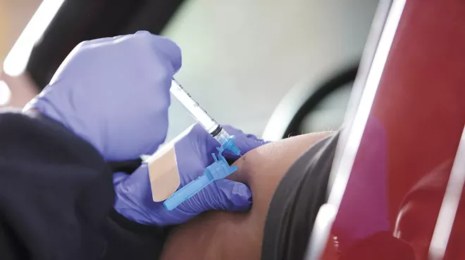 A dose of the Moderna COVID-19 vaccine is administered at the Spokane Fire Department Training Center.