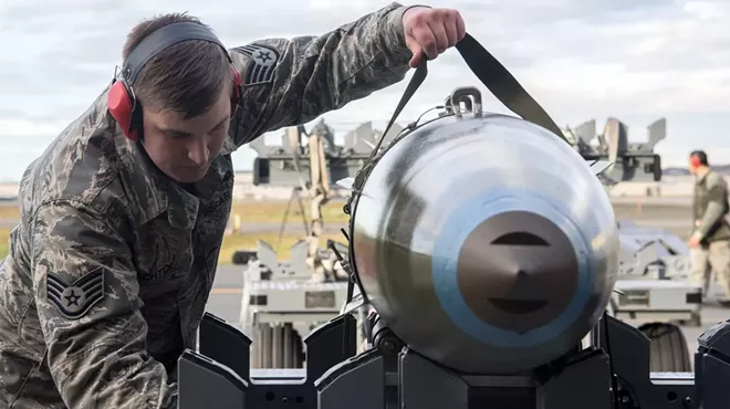 Taylor Bechtol, then an Air Force staff sergeant, with munition at Joint Base Elmendorf-Richardson in Alaska on Oct. 26, 2018. Bechtol has been linked to the Boogaloo Bois.