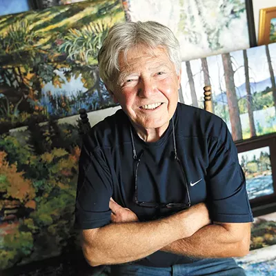 Artist L.R. Montgomery and his paintings of the Spokane River.