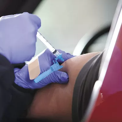 Why is it taking so long to give out lifesaving vaccines in Washington state?