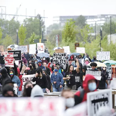 Demonstrators march through Riverfront Park during a Defund the Police protest last June.