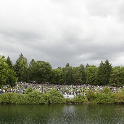 Demontrators listen to speakers at the Lilac Bowl Amphitheater at Riverfront Park.