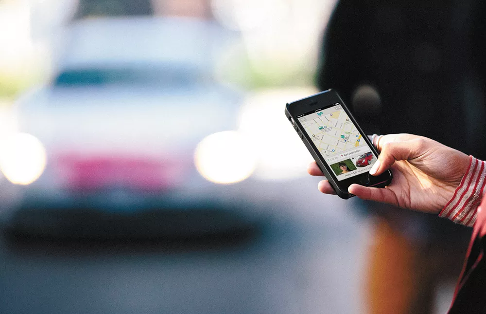 Uber charges fares, while Lyft users pay "donations," but both rely on smartphone apps, not taxi meters.