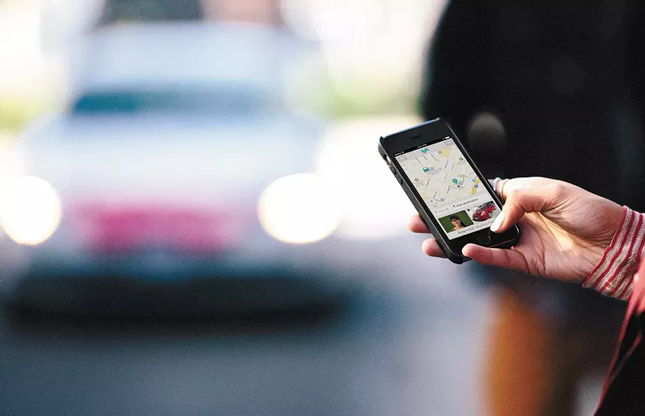 Uber charges fares, while Lyft users pay "donations," but both rely on smartphone apps, not taxi meters.