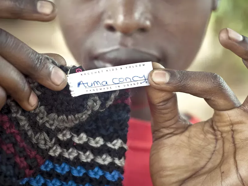 Ugandan Auma Concy shows off her handiwork. - KROCHET KIDS INTERNATIONAL
