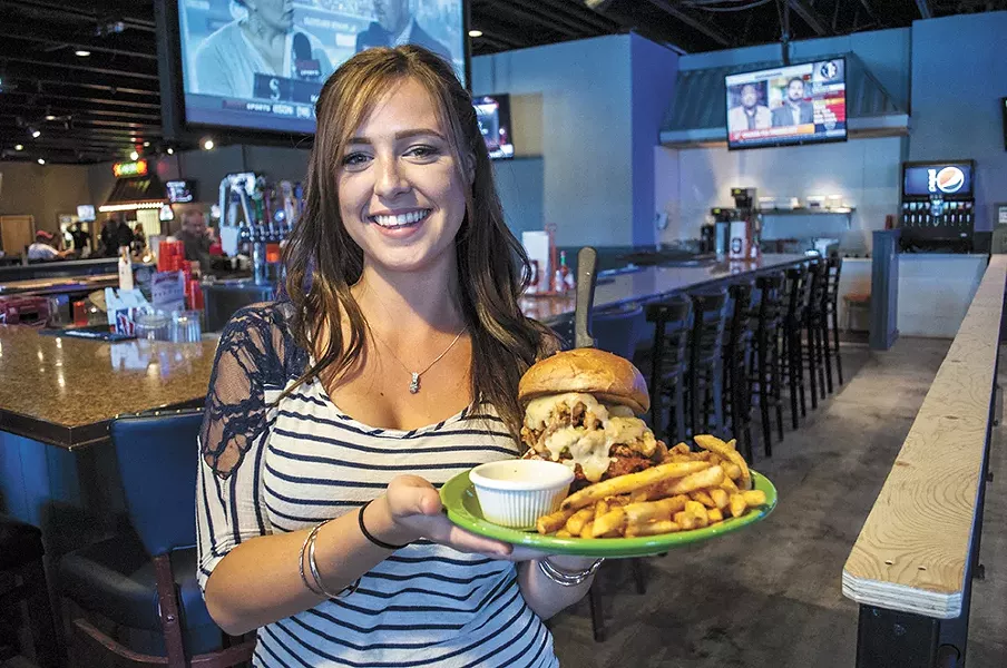 Waitress Summer Williamson with the massive Angry Lucy burger at 50/Fifty. - SARAH WURTZ