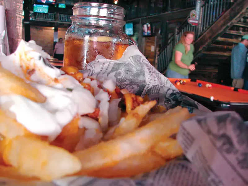 What's that? Behind the White Trash Chili Cheese Fries? A mason jar of beer? Why yes, we think it is. - CARRIE SCOZZARO