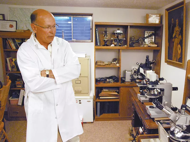 William Schneck, in his basement lab: "I\'m searching for truth and justice." - BEN CRIST