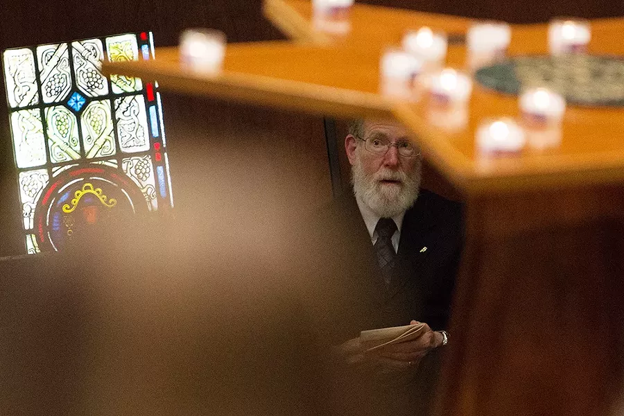 Yom HaShoah Planning Committee member Hershel Zellman watches a speaker. - YOUNG KWAK