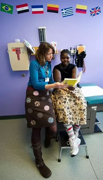 Dr. Andrea Green with Kamikazi Odreille, 12, of Burlington, reading Ramona Quimby, Age 8 - ANDY DUBACK