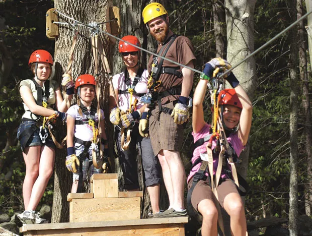 Sliding down the zip line at Smuggs
