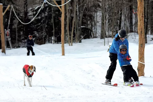 Family members ride the rope tow - TRISTAN VON DUNTZ