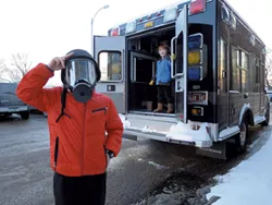 "I'm ready for the zombie invasion!" announced Rob Safran, trying on a police gas mask outside the Burlington Police Department's tactical platform vehicle. - MATTHEW THORSEN