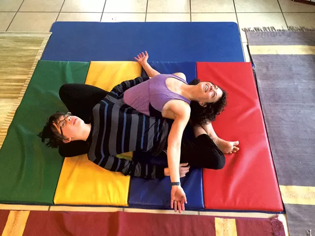 Janet and Adam practice the yin-yang stretch - COURTESY OF JANET FRANZ