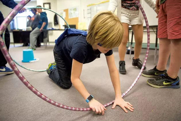 George Francisco navigating an obstacle course while blindfolded at Williston Central School - JAMES BUCK