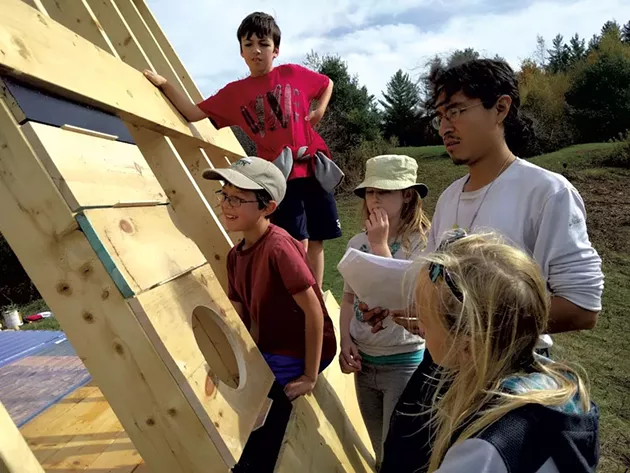 Eddie Merma with his building students - SARAH YAHM