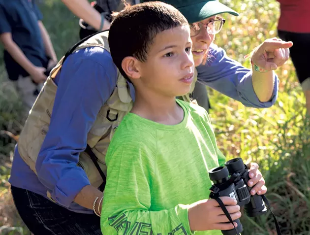 UVM lecturer Trish O’Kane and Flynn fifth grader Yadiel - KEN PICARD
