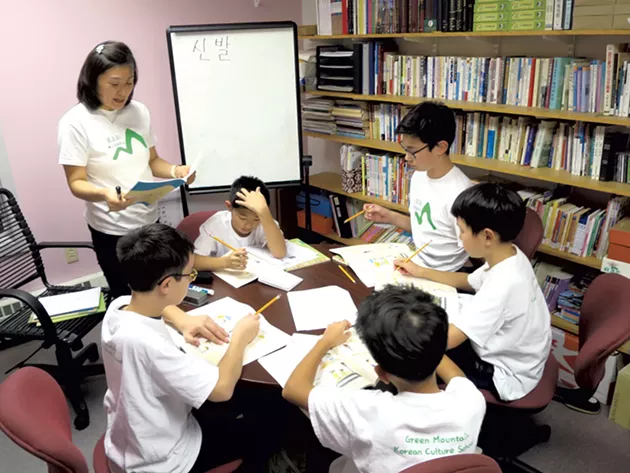 Green Mountain Korean Culture School teacher Yeonju Kim with students (clockwise) Andrew Kim, Nick Rancourt, Dan Lee, Sangmin Lee and Casey Sullivan - MATTHEW THORSEN