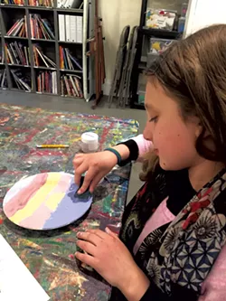 Mira finishes her sunset plate - ALISON NOVAK