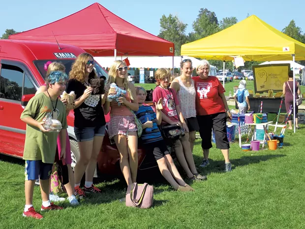 DeLaBruere (right) and Maker Faire attendees in front of EMMA - MATTHEW THORSEN