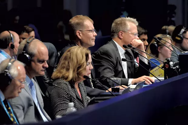 Dr. Bailly (center) pronouncing at last year's Scripps National Spelling Bee - COURTESY OF MARK BOWEN/SCRIPPS NATIONAL SPELLING BEE