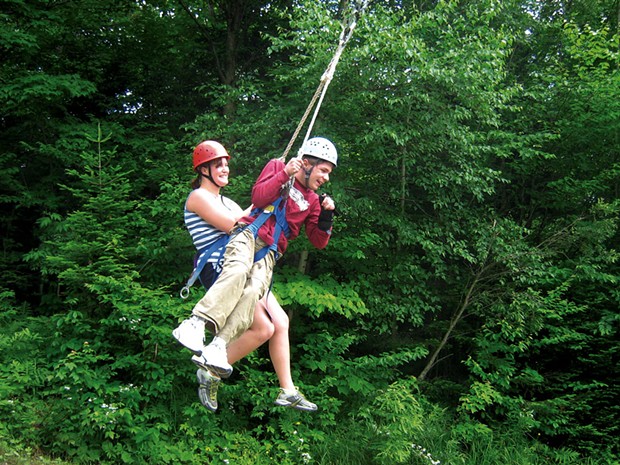 Former Partners in Adventure staff member Sarah and camper Chris swing together at Bolton Adventure Center - COURTESY OF DEBBIE LAMDEN