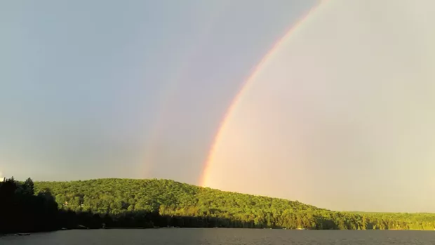 A rainbow over Caspian Lake - MOLLY RITVO